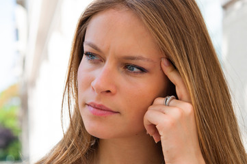 Fototapeta premium beautiful young attractive woman outdoors portrait of thinking w
