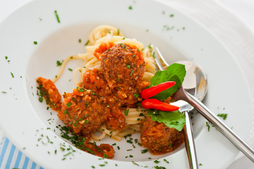 Original Italian spaghetti with meatballs in tomato sauce