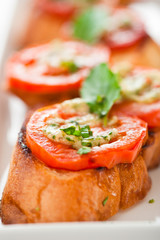 Bruschetta - gold baked baguette with tomato garlic and basil as