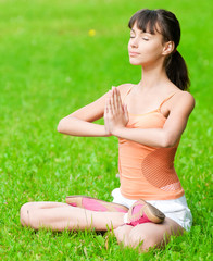 Teenage girl doing yoga exercise