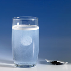 fizzy tablet in a glass of water