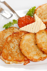 fried potatoes pancakes with caviar