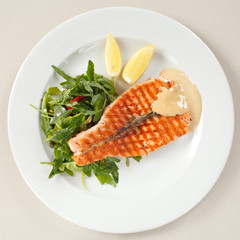 salmon steak with salad