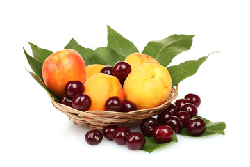 tasty summer fruits in backet isolated on white