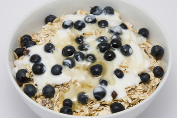 Bowl of muesli with yogurt and blueberries