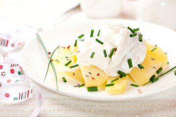 Potato salad with herring and sour cream for Christmas