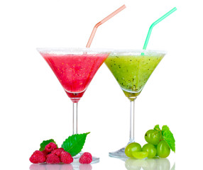 Delicious fruit smoothies and fruit isolated on white