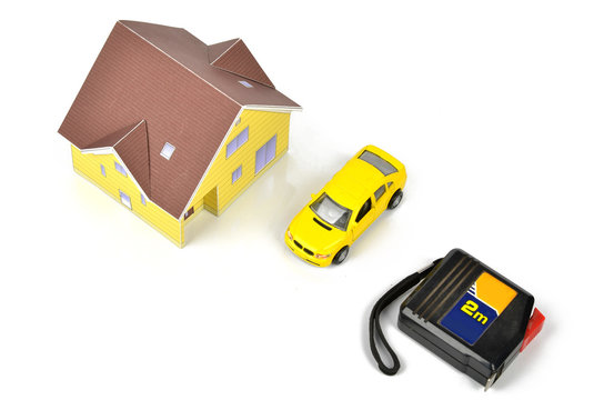 Steel tape and model house with toy car