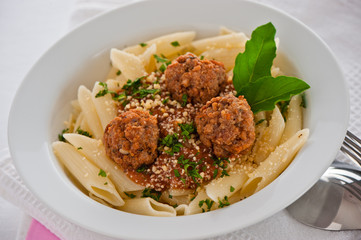 Pasta with tomato garlic sauce and meatballs