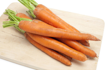 carrots on wooden board