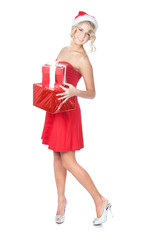 Beautiful blonde christmas woman holding gifts wearing Santa hat