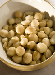 Closeup on raw macadamia nuts in a bowl