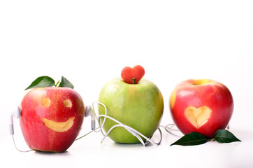 Tree apples with mp3-player and headphone