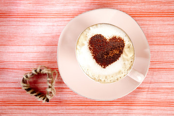 cappuccino with heart, red stripy backdrop
