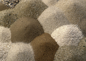 different brown toned sand piles to one another