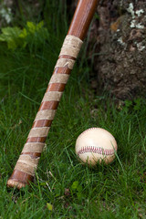 Old Vintage Baseball and Wooden Bat