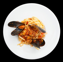 Fried mussels with pasta isolated on black