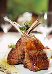 Raw rack of lamb fried with herbs and spices