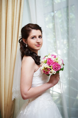 Fototapeta premium Happy bride with wedding bouquet