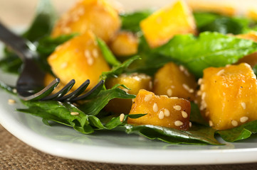 Baked pumpkin, spinach and sesame salad