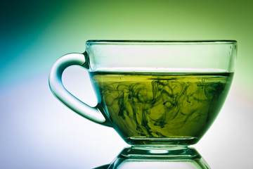 Strange green tea in small cup