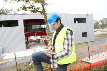 Construction manager using electronic tablet on site
