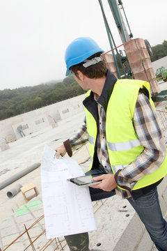 Construction manager using electronic tablet on site