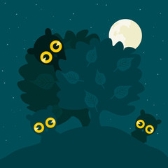 Fototapeta na wymiar Owls hide behind a tree at night