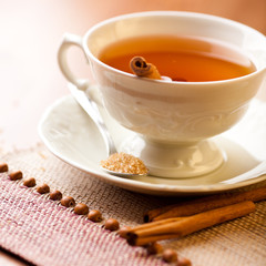 Cup of tea with cinnamon and brown sugar