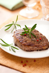 Grilled beefsteak with rosemary and peppercorns