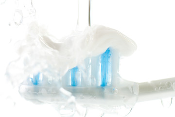 Wet Toothbrush with Toothpaste Isolated on White