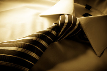 Tie cast shadows on the shirt tied knot, sepia