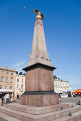 Fototapeta na wymiar granitic obelisk on Market square in Helsinki