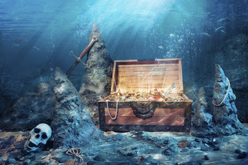 open treasure chest with bright gold underwater