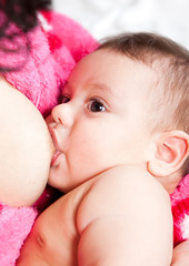 Mother breast feeding her infant