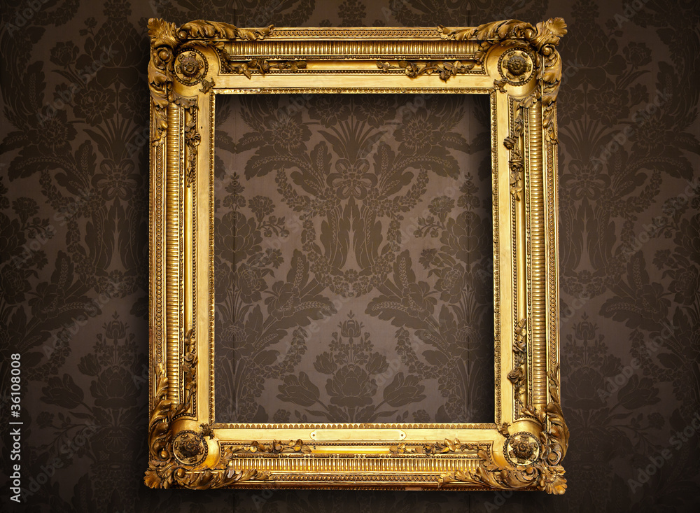 Wall mural empty golden painting frame on vintage wallpaper