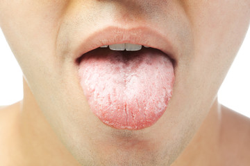 closeup of young men shows tongue isolated on white background © Tiler84