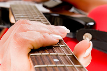 hands and fingers with a guitar