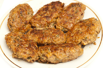 Cutlets on a white plate. Closeup
