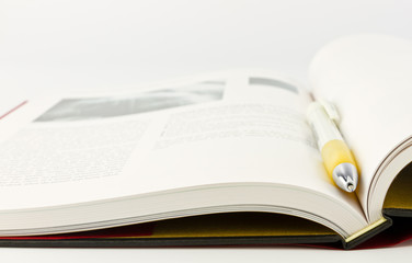 Open book with pen