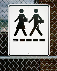 Sign - Man and Woman Symbols Walking with Briefcases