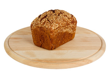 Baked rye bread with linseeds on the white isolated background