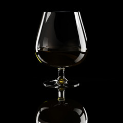 Glass of brandy over black