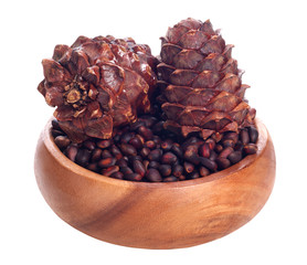 pine lump and pine nuts on white background