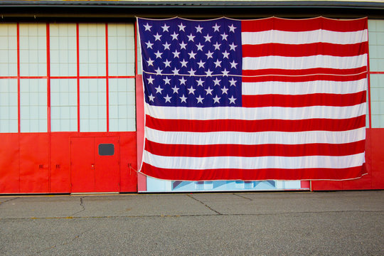 Big American Flag on Industrial Building Facade