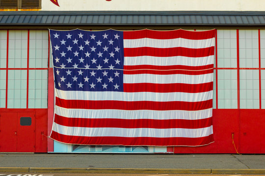 Big American Flag on Industrial Building