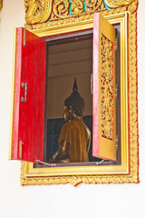 Ancient Golden carving wooden door of Thai temple in Bangkok, Th