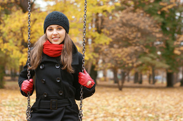 Young attractive girl in autumn park