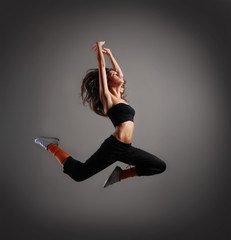 A young brunette woman cought in a jump