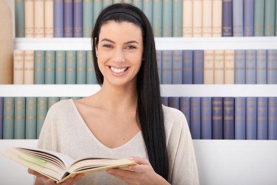 Laughing woman with book